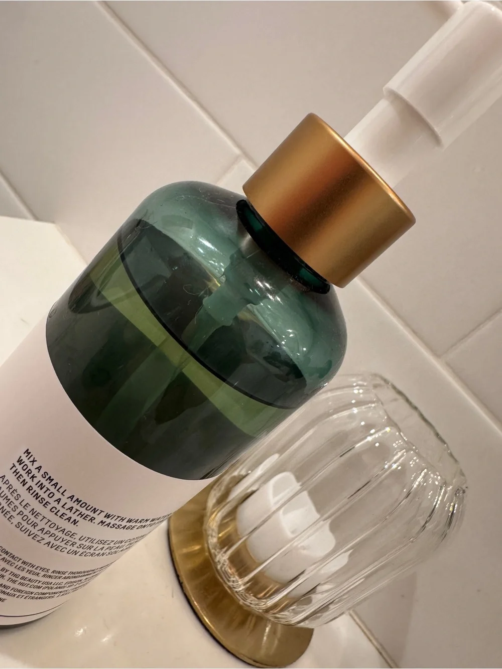 Biossance green and gold pump facial cleanser